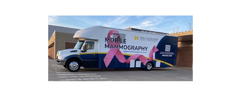 white van with pink ribbon and Rogel Cancer Center logo