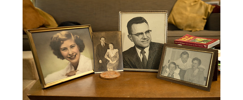 Four framed photographs of older relatives all in black and white