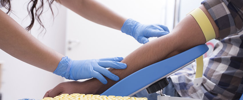 Close up of man having his blood drawn