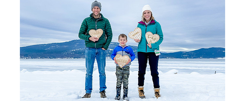 Koskinen with her husband and son standing in the snow