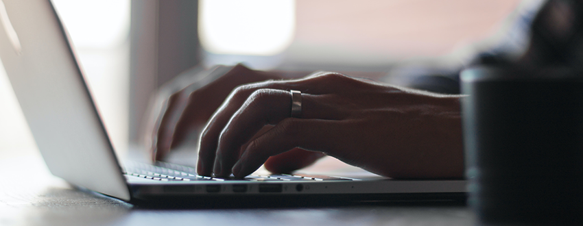 person typing on a computer