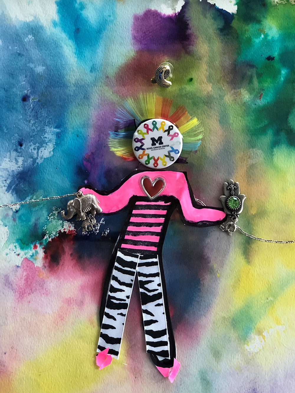 figure of hope with hair made of cancer ribbons, zebra pants and a bright pink shirt